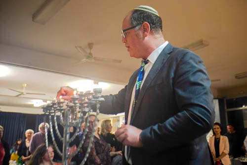 Selection – North Shore Synagogue Chanukah Celebration – Rabbi Paul Lewin lights the chanukiah 5-12-21 – -3