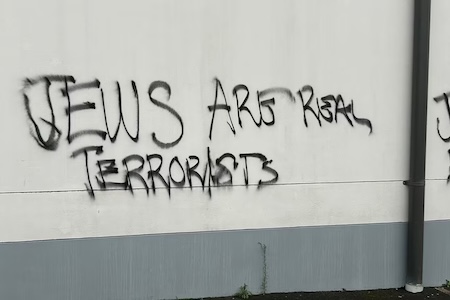 Antisemitic graffiti sprayed on a wall at Mt Sinai College