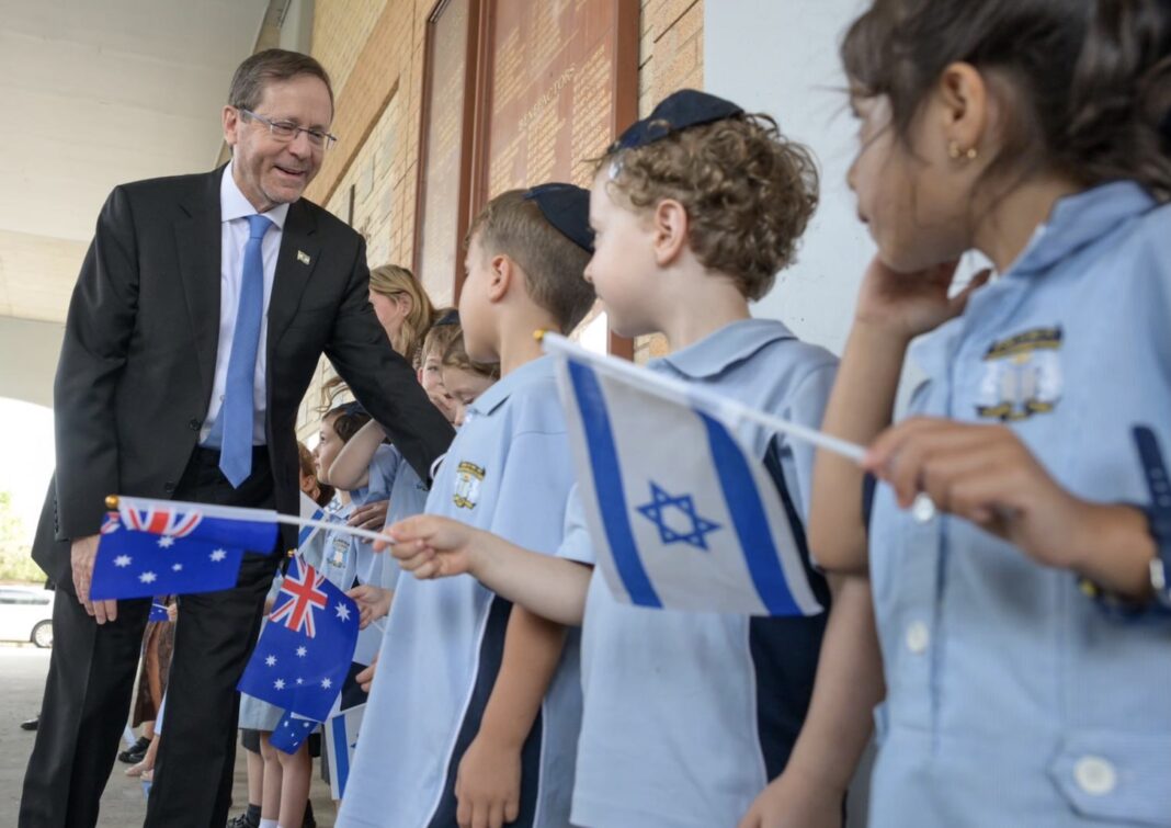 President Herzog is greeted by children at Moriah College
