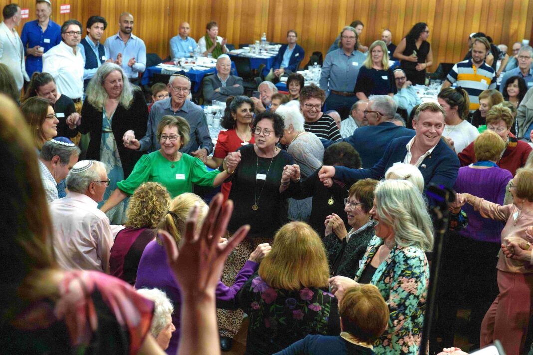 Attendees dance the hora