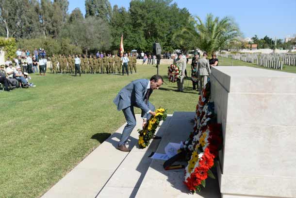Abassador Dave Sharma lays a wreath