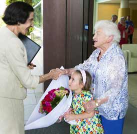 Dame Marie Bashir with student volunteer Jenna Dave and resident volunteer Selina Brandon