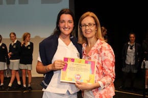 Gabrielle Upton (rt) presents a certificate