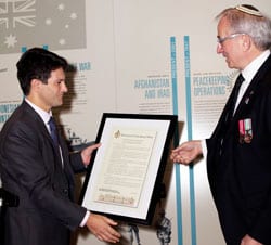 Victor Dominello present Charles Aronson with a certificate