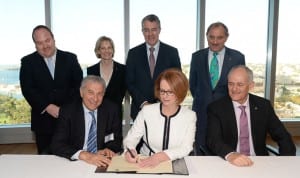 Prime Minister Julia Gillard signs the London Declaration