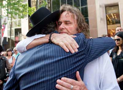 Ken Johnsopn hugs Rabbi Levi Wolff Photo: Henry Benjamin/J-Wire