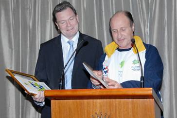 reestom Tom Goldman makes a presentation to Premier Nathan Rees