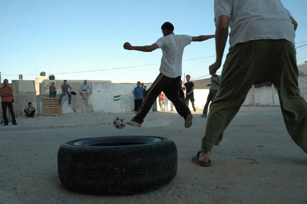 Palestinians play soccer in the West Bank. Credit: Justin McIntosh via Wikimedia Commons.