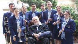 Tommy Tycho surrounded by some of the musicians of Symphonic Winds Ensemble